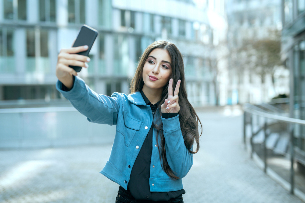 Teenager,Girl,In,Urban,City,Take,Selfie,Picture,By,Smartphone